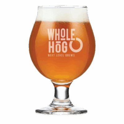 Glass of Whole Hog beer with logo