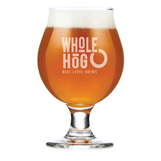 Glass of Whole Hog beer with logo