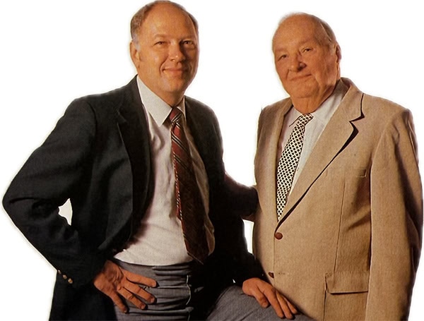 Ken Shibilski and another man pose next to each other in 1970s-era business suits.